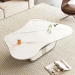 Modern butterfly coffee table with sintered stone top and storage drawer in living room