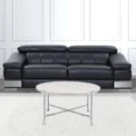 Goldoma 36-inch round coffee table with white paper veneer top and silver metal cross legs in a modern living room