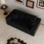 Goldoma modular loveseat sofa bed in black corduroy upholstery with iron legs, showing sofa bed conversion for small spaces