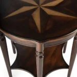 Goldoma 28-inch round coffee table with brown wood top and black metal shelf in a modern rustic living room