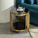 Goldoma modern round glass coffee table with gold stainless steel base in living room setting