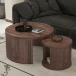 Goldoma round nesting coffee table set of 2 in natural wood and walnut finish, displayed in a modern living room