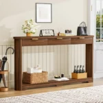 Modern console table with wavy patterned front and two storage drawers in a living room setting