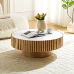 Goldoma nesting round coffee table with sintered stone top in a modern living room setting