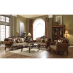 Brown damask chesterfield loveseat with genuine leather, rolled arms, and two toss pillows