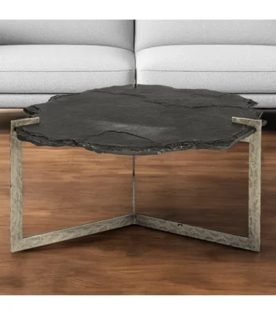 Goldoma 40 inch free form coffee table with distressed black stone top and gold iron base in a living room