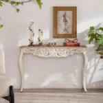 Goldoma French vintage carved distressed white console table in entryway with decor