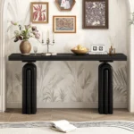 Modern acacia veneer console table in gray and black finish placed in an entryway with decorative items on top