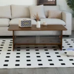 Goldoma 47-inch modern minimalist coffee table with storage cabinet and glass sliding doors in a living room setting