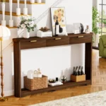 Modern console table with wavy patterned front and two storage drawers in a living room setting