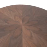 Goldoma modern oval coffee table with stainless steel base and marble wood top in a living room setting
