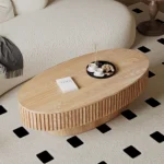 Goldoma 43.7-inch oval drum coffee table in walnut finish with solid wood top and MDF base on a modern living room floor