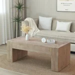 Goldoma 49-inch farmhouse coffee table in black engineered wood with antique finish, placed in a living room