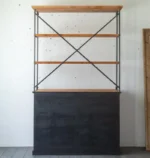 Antique wine bar cabinet with solid wood and iron finish, displaying wine bottles and barware in a living room