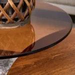 Modern double-layer coffee table with wood top and black MDF L-shaped legs in a living room setting