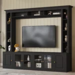 modern entertainment center with black bookshelves and tempered glass doors holding a large TV