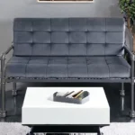 Goldoma 51 inch gray velvet loveseat with tufted Chesterfield design in a living room