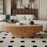 Goldoma 43.7-inch oval drum coffee table in walnut finish with solid wood top and MDF base on a modern living room floor