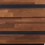 Black and brown wood and iron end table with two drawers in a living room setting
