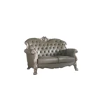 Goldoma 71-inch bone faux leather loveseat with tufted backrest, square arms, and toss pillows