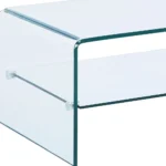 Goldoma 43-inch glass sled coffee table with brass frame and lower shelf in a modern living room