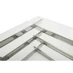 Goldoma 39-inch square glass coffee table with stainless steel sled base and lower shelf in a modern living room setting