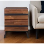 Black and brown wood and iron end table with two drawers in a living room setting