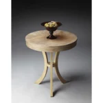 Goldoma 26 inch beige distressed round three-leg end table in a living room setting
