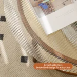 Modern farmhouse nesting coffee table set with ribbed glass tops and copper accents on a living room floor