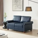 Goldoma black faux leather loveseat with memory foam cushions and wood legs in a modern living room