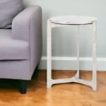 White marble round end table with silver aluminum cross legs in living room setting - Goldoma 25 inch marble side table