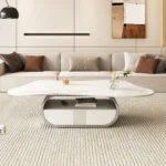 Modern butterfly coffee table with sintered stone top and storage drawer in living room