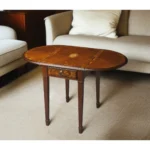 Goldoma 19-inch oval farmhouse coffee table with drawer and brown wood finish in a living room