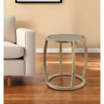 Goldoma 26-inch round end table with clear glass top and brown wood base in a living room setting