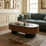 Goldoma 43.7 inch elliptical modern coffee table with hidden storage and removable tabletop in a living room setting