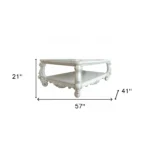 Goldoma antiqued white oak coffee table with shelf in farmhouse living room setting