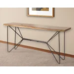 Solid acacia console table with live edge and black iron geometric base in an entryway