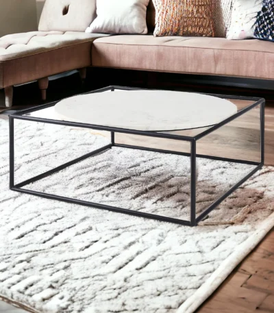 Goldoma 36 inch genuine marble coffee table with white marble top and black metal base in a modern living room setting