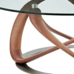 Goldoma 39 inch round clear glass coffee table with brown solid wood base in a modern living room