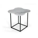 Goldoma 15 inch free form modern white marble end table with black metal base placed beside a sofa in a living room