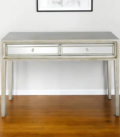 Silver mirrored console table with drawers by Goldoma in antiqued silver finish, 48 inches wide, placed in an entryway