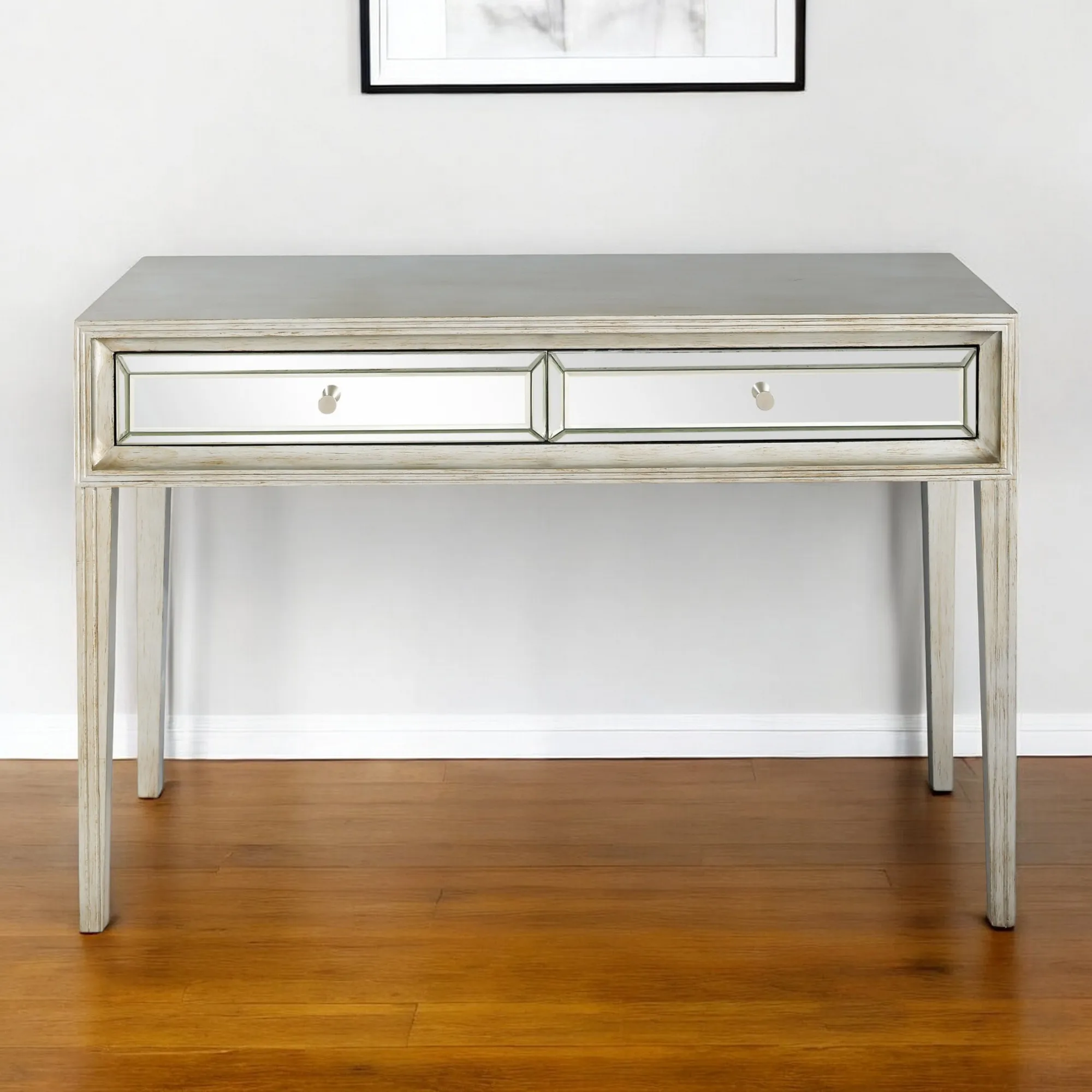 H9e104225ade24313a994a15a5296a67aV.webp Silver mirrored console table with drawers by Goldoma in antiqued silver finish, 48 inches wide, placed in an entryway