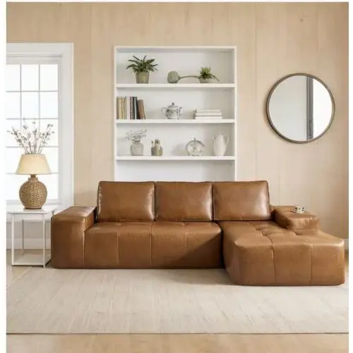 H9ec0e76b57fd4819be66084408a5aac0I.webp Goldoma brown faux leather cloud sectional sofa with tufted back and deep seat chaise in a modern living room