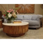 Goldoma 42 inch round marble coffee table with genuine ivory marble top and natural solid wood ribbed base in a modern living room