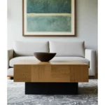 Goldoma 40" solid wood coffee table with brown top and black base, modern geometric design in a living room