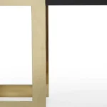 Goldoma 52-inch black and gold glass pedestal console table in a modern living room setting