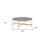 Goldoma 35 inch round glass coffee table with gold stainless steel frame and gray tempered glass top in living room