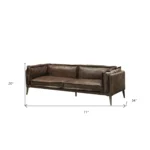 Goldoma 71-inch chocolate top grain leather loveseat with silver legs in living room