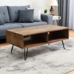 Goldoma 23-inch industrial coffee table with storage shelf, brown wood top and black metal frame in a living room