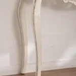 Goldoma French vintage carved distressed white console table in entryway with decor